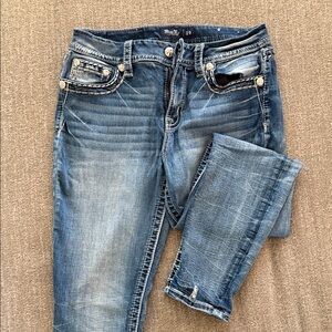 Miss Me Curvy Ankle Skinny Jeans with Whiskering and Embellished Pockets